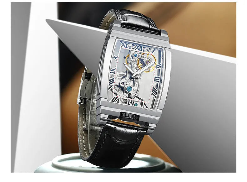 Daystar square dial manual mechanical watch with stainless steel case on a leather strap.