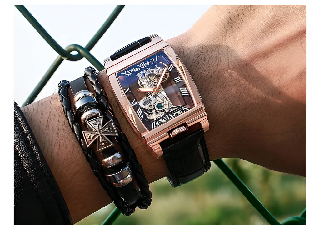 Daystar square dial manual mechanical watch with stainless steel case on a leather strap.