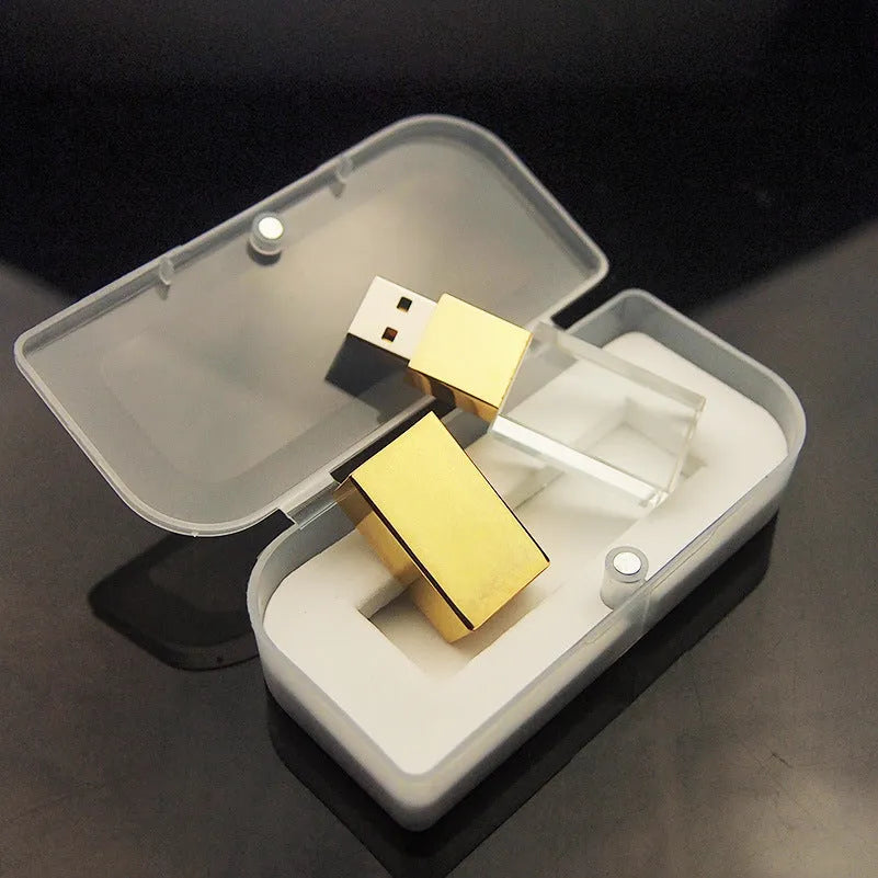 Crystal USB flash drive with transparent glass and stainless steel shell, gold colour, USB 2.0 connector visible
