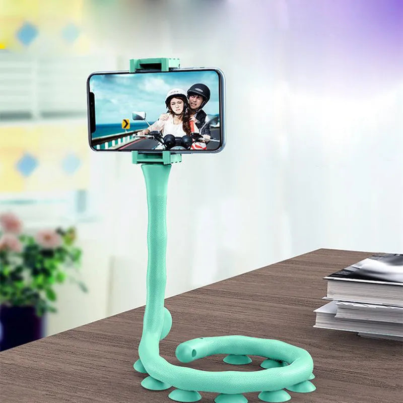 Black flexible worm arm phone holder with suction cup extended, showing 360-degree rotating bracket.