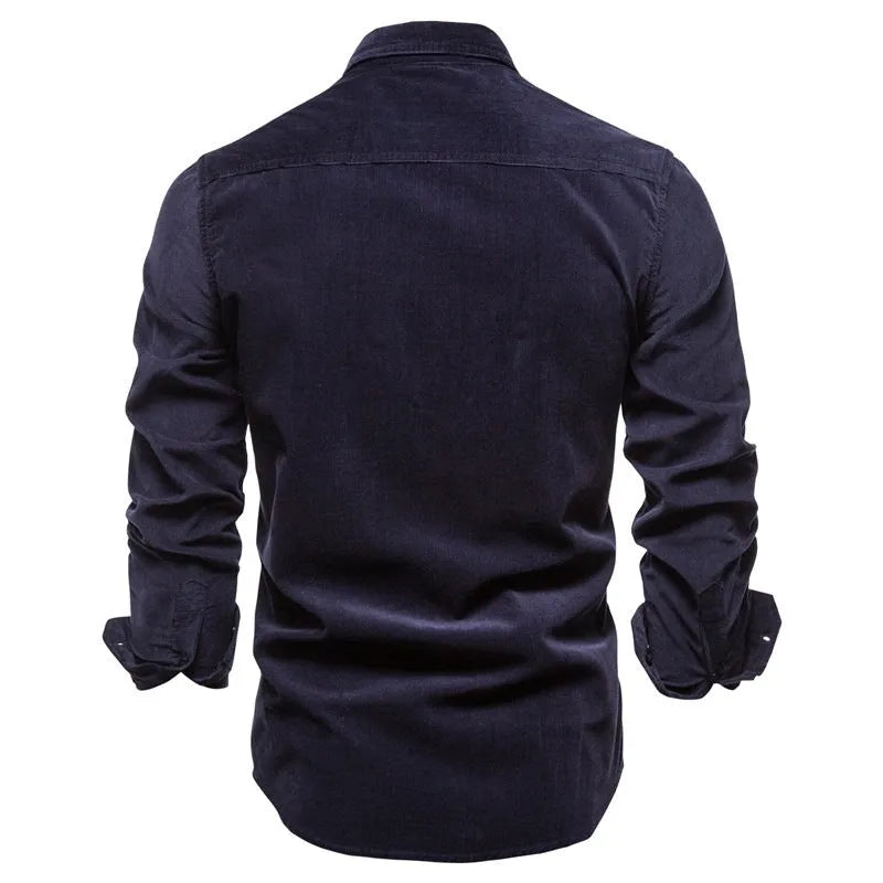Men's long sleeve linen shirt in denim blue on a hanger, showing button front and casual style.