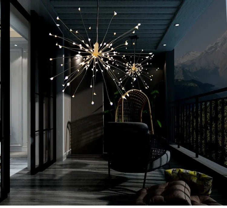 Solar-powered LED firework explosion light hanging outdoors with warm white meteor shower effect.
