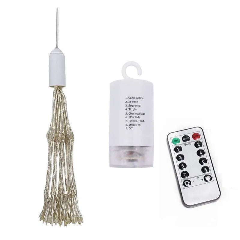 Solar-powered LED firework explosion light hanging outdoors with warm white meteor shower effect.
