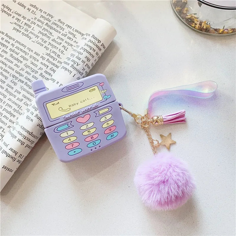 Purple silicone clamshell case for Apple AirPods Pro and AirPods 1 2 with a fur ball pendant.