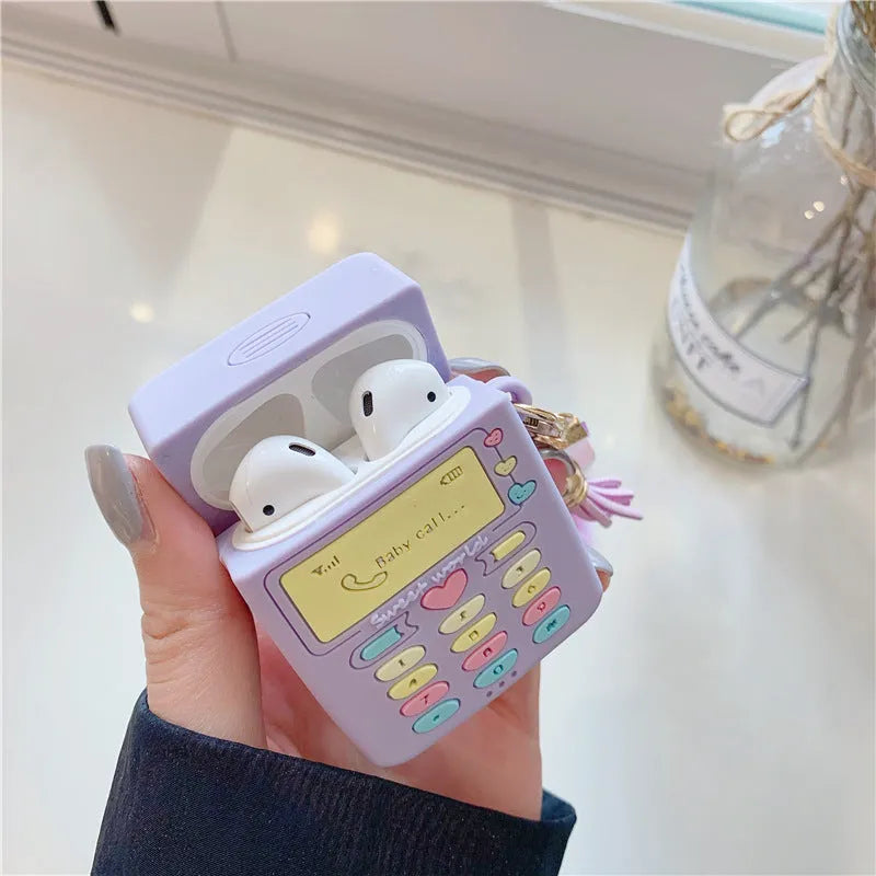 Purple silicone clamshell case for Apple AirPods Pro and AirPods 1 2 with a fur ball pendant.