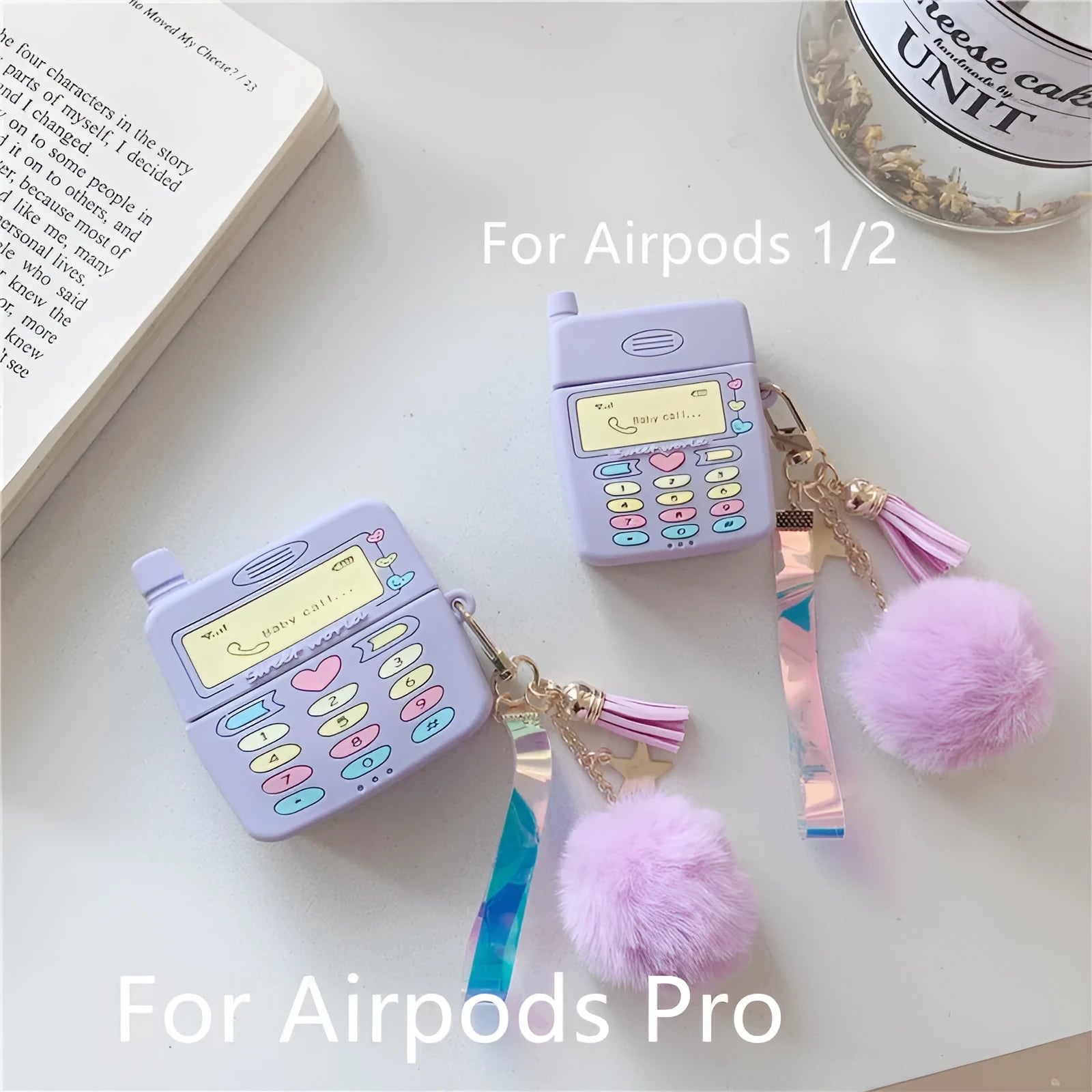 Purple silicone clamshell case for Apple AirPods Pro and AirPods 1 2 with a fur ball pendant.