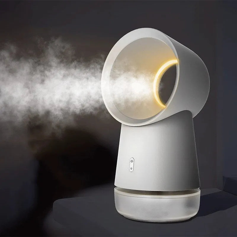 White round desktop humidifier with leafless fan vent, ultrasonic cool mist fog outlet, USB cable, and warm night light glowing