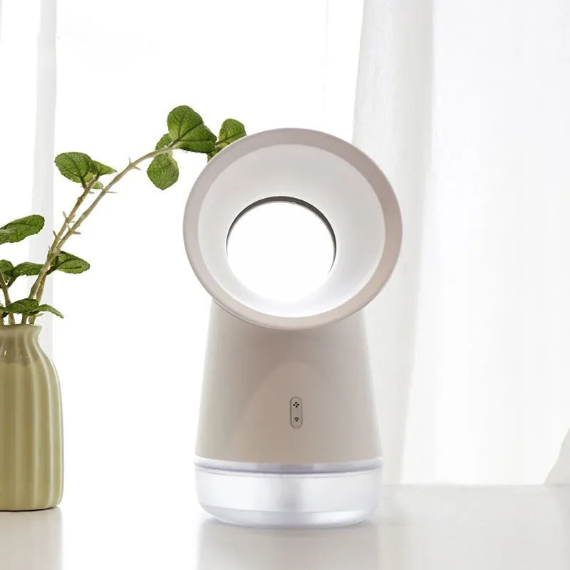 White round desktop humidifier with leafless fan vent, ultrasonic cool mist fog outlet, USB cable, and warm night light glowing