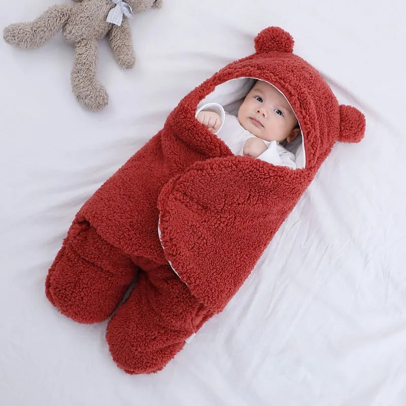 Baby quilted sleeping bag wrapper in cotton blend fabric with polyester cotton filling, shown in one of six colours