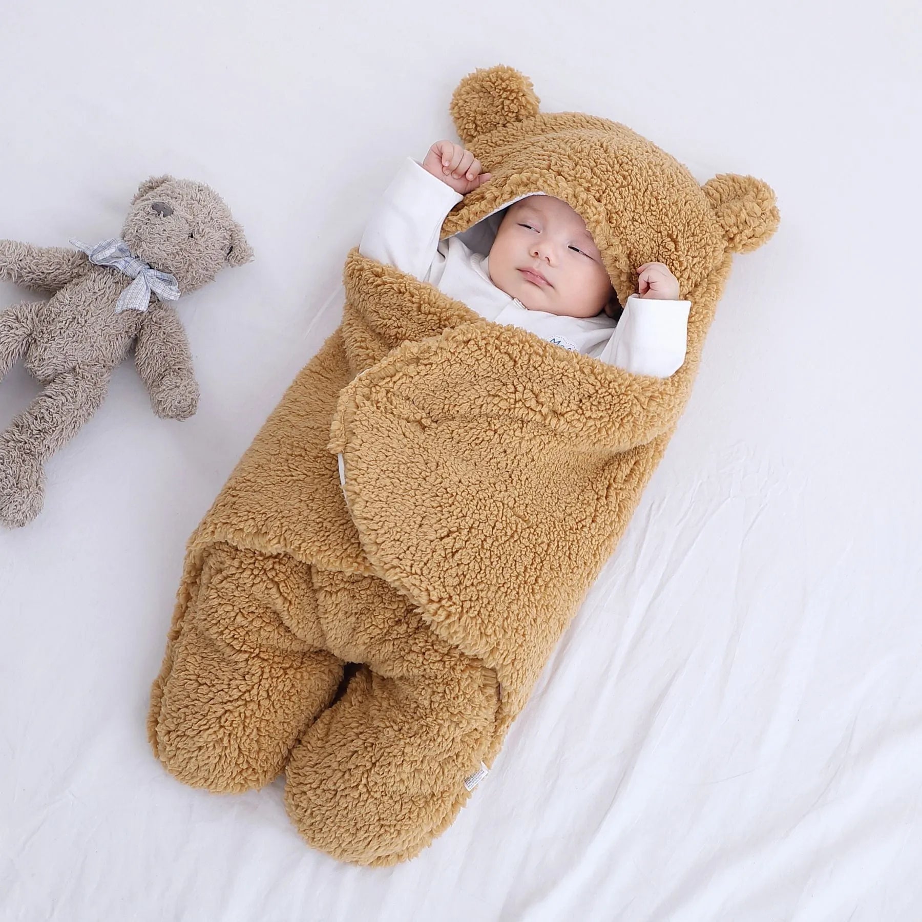Baby quilted sleeping bag wrapper in cotton blend fabric with polyester cotton filling, shown in one of six colours