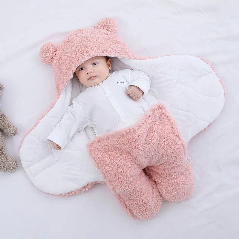 Baby quilted sleeping bag wrapper in cotton blend fabric with polyester cotton filling, shown in one of six colours
