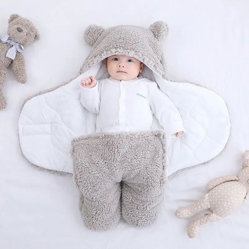 Baby quilted sleeping bag wrapper in cotton blend fabric with polyester cotton filling, shown in one of six colours