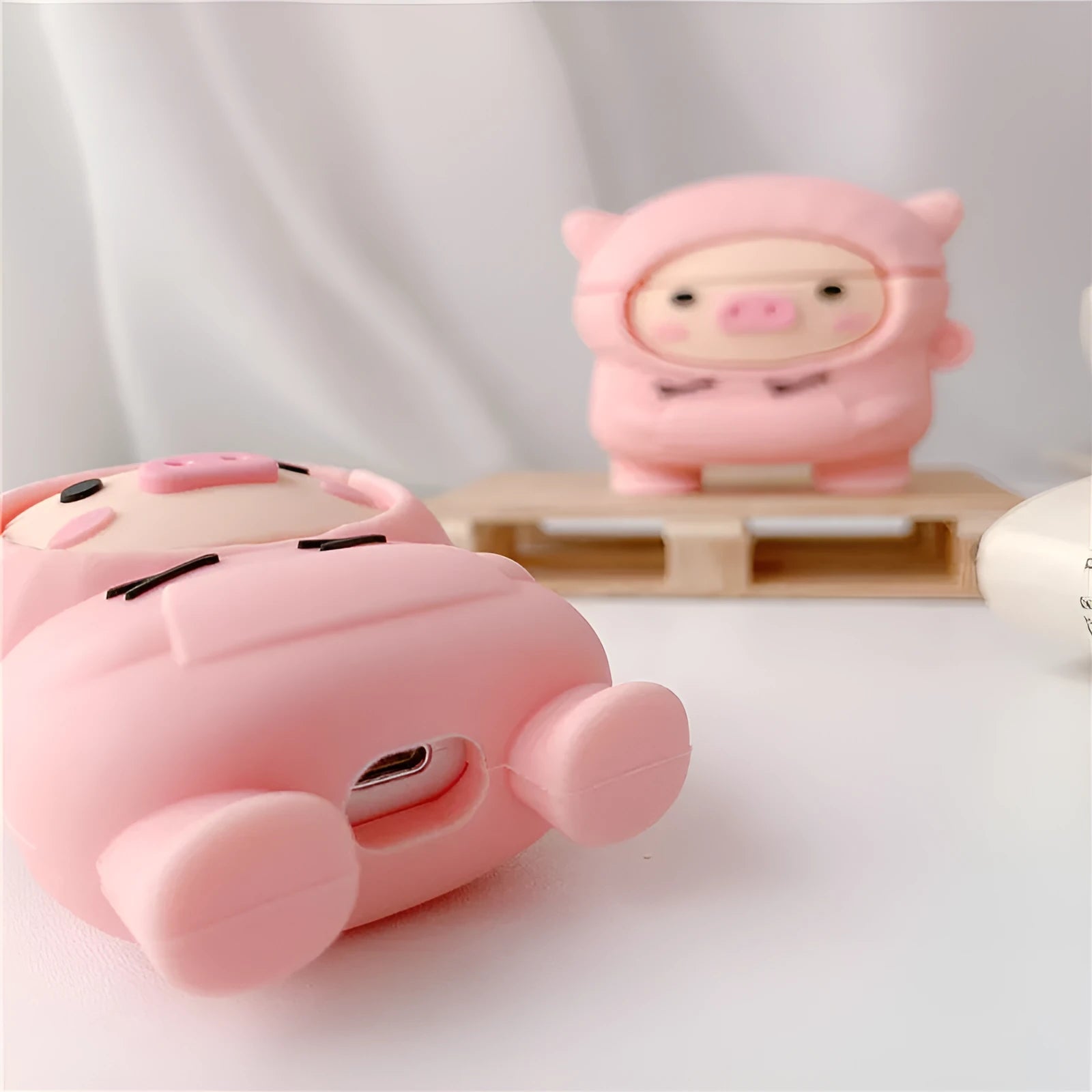 Pink silicone flip case for Apple AirPods with cartoon pig ears design and carrying hook