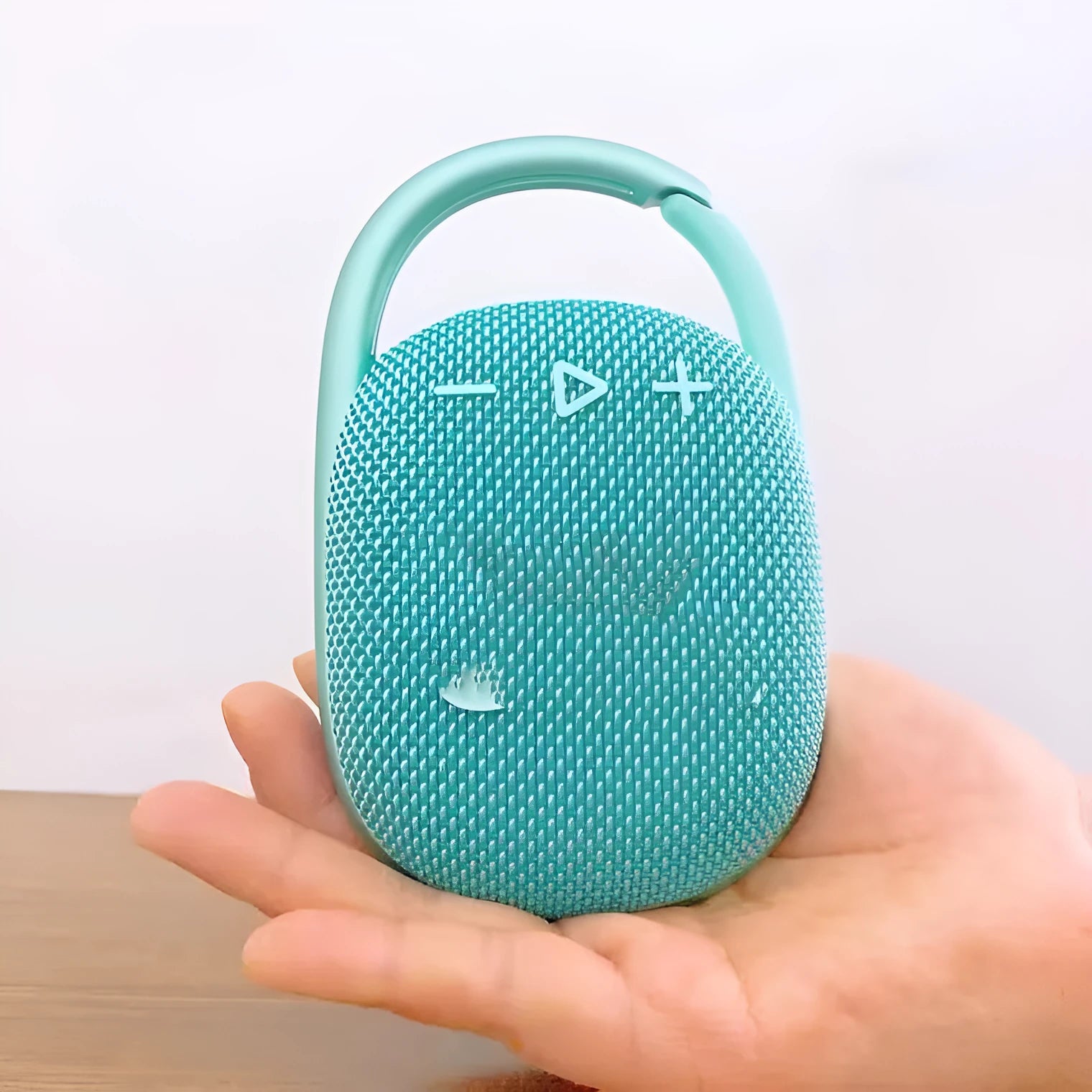 Mini portable Bluetooth speaker in one of six colours: black, blue, green, pink, red, or silver grey.