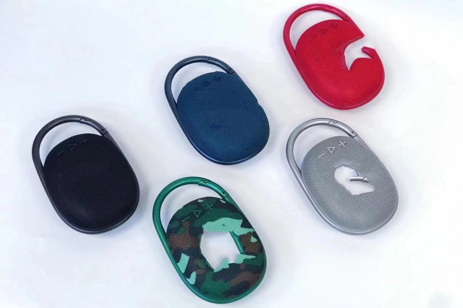 Mini portable Bluetooth speaker in one of six colours: black, blue, green, pink, red, or silver grey.