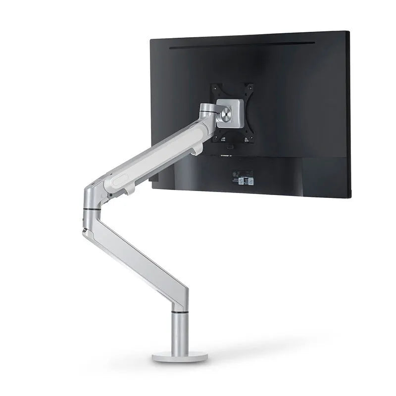 Adjustable lifting computer monitor stand in silver on a desk with a screen placed on top