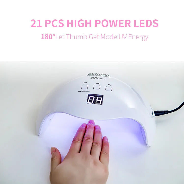 White SUN X9Plus nail phototherapy LED lamp with 21 beads and induction sensor on a desk