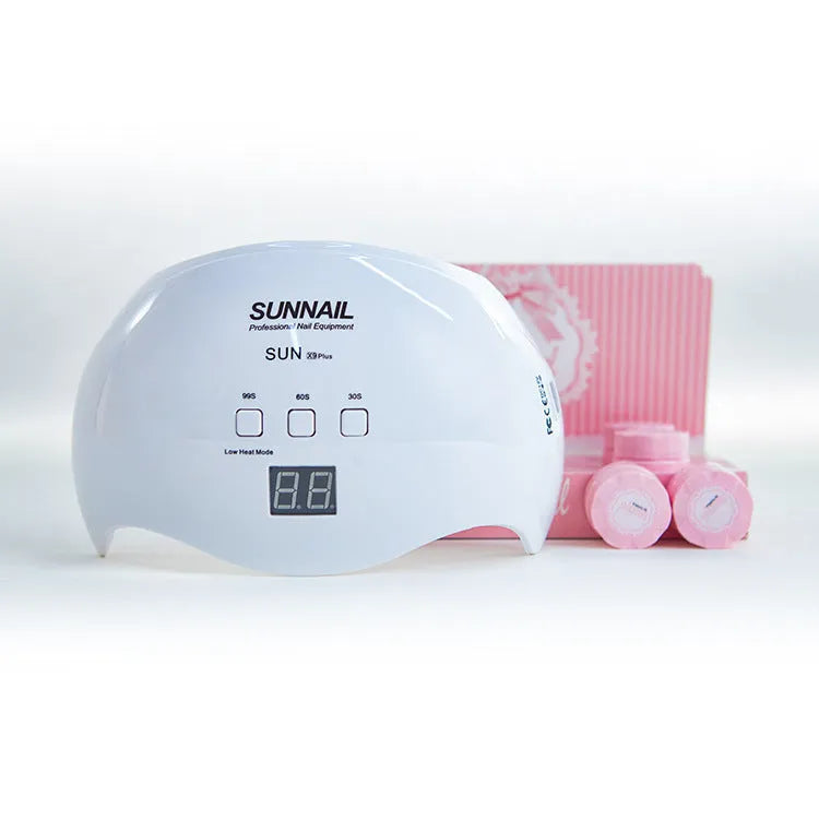 White SUN X9Plus nail phototherapy LED lamp with 21 beads and induction sensor on a desk