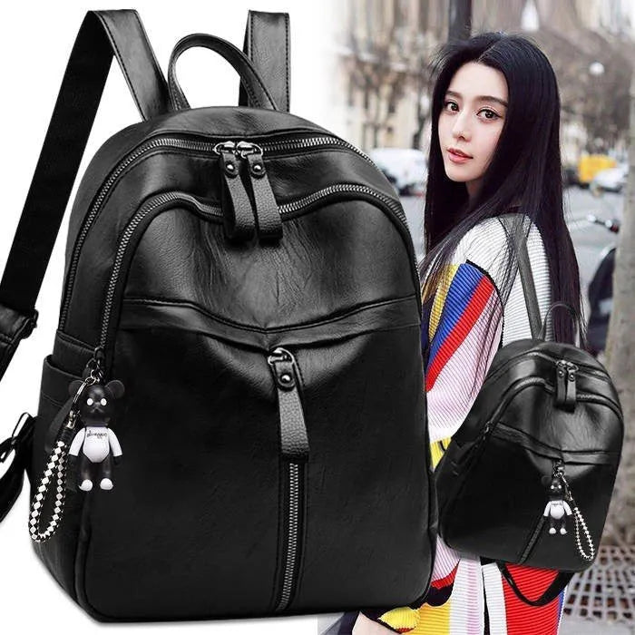 Black PU leather soft surface backpack with double straps showing 20-35L capacity and plain design