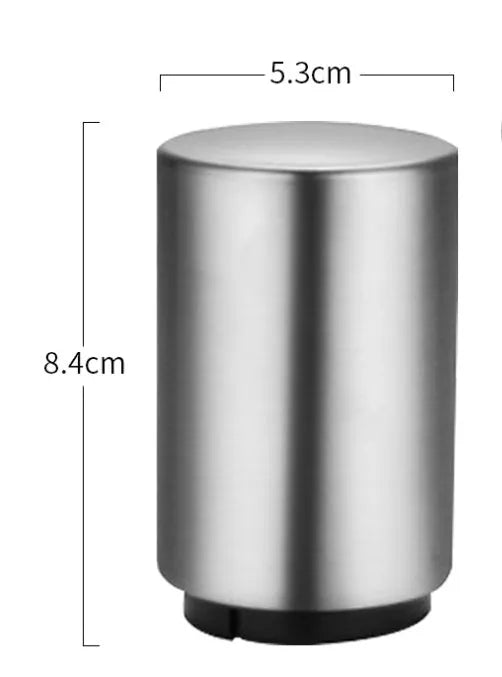 Stainless steel automatic beer bottle opener with press mechanism and magnetic cap catcher on a table