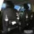 PU leather car storage hanging bag attached to car seat back with multiple pockets and built-in tissue box