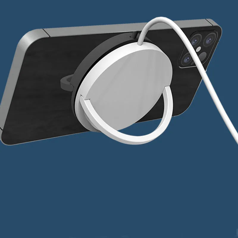 Black mobile phone magnetic bracket wireless charger with Type-C input on a desk