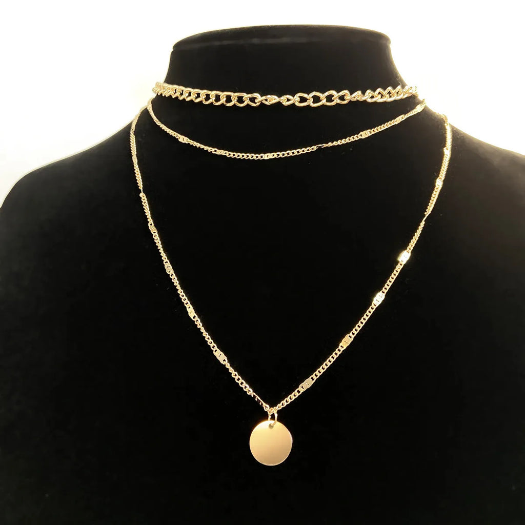 Women's multilayer disc pendant necklace in gold alloy electroplated finish on clavicle-length chain