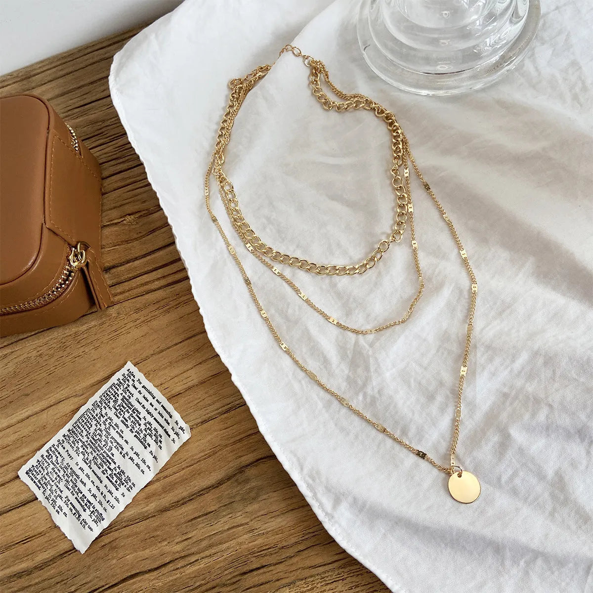 Women's multilayer disc pendant necklace in gold alloy electroplated finish on clavicle-length chain