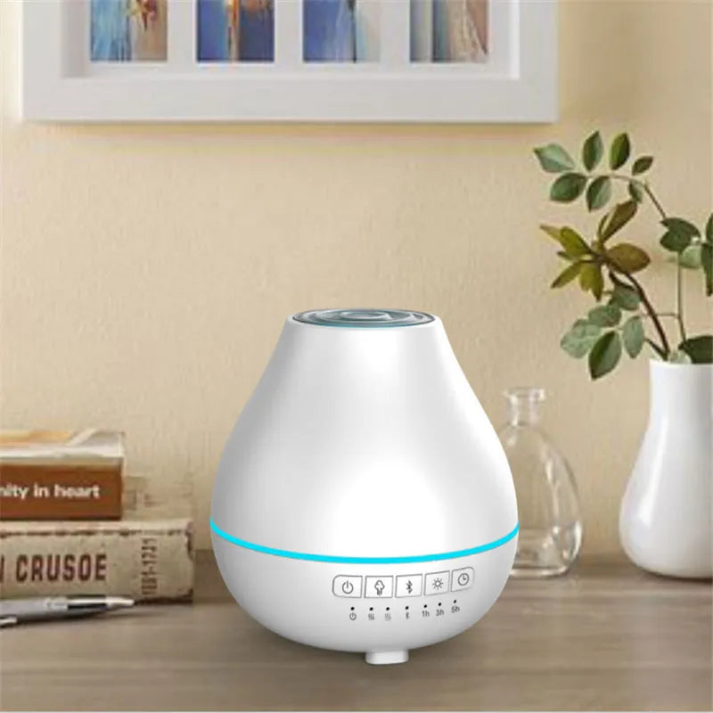 Round white Bluetooth humidifier and aroma diffuser with water tank and control buttons