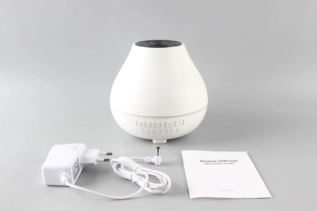 Round white Bluetooth humidifier and aroma diffuser with water tank and control buttons