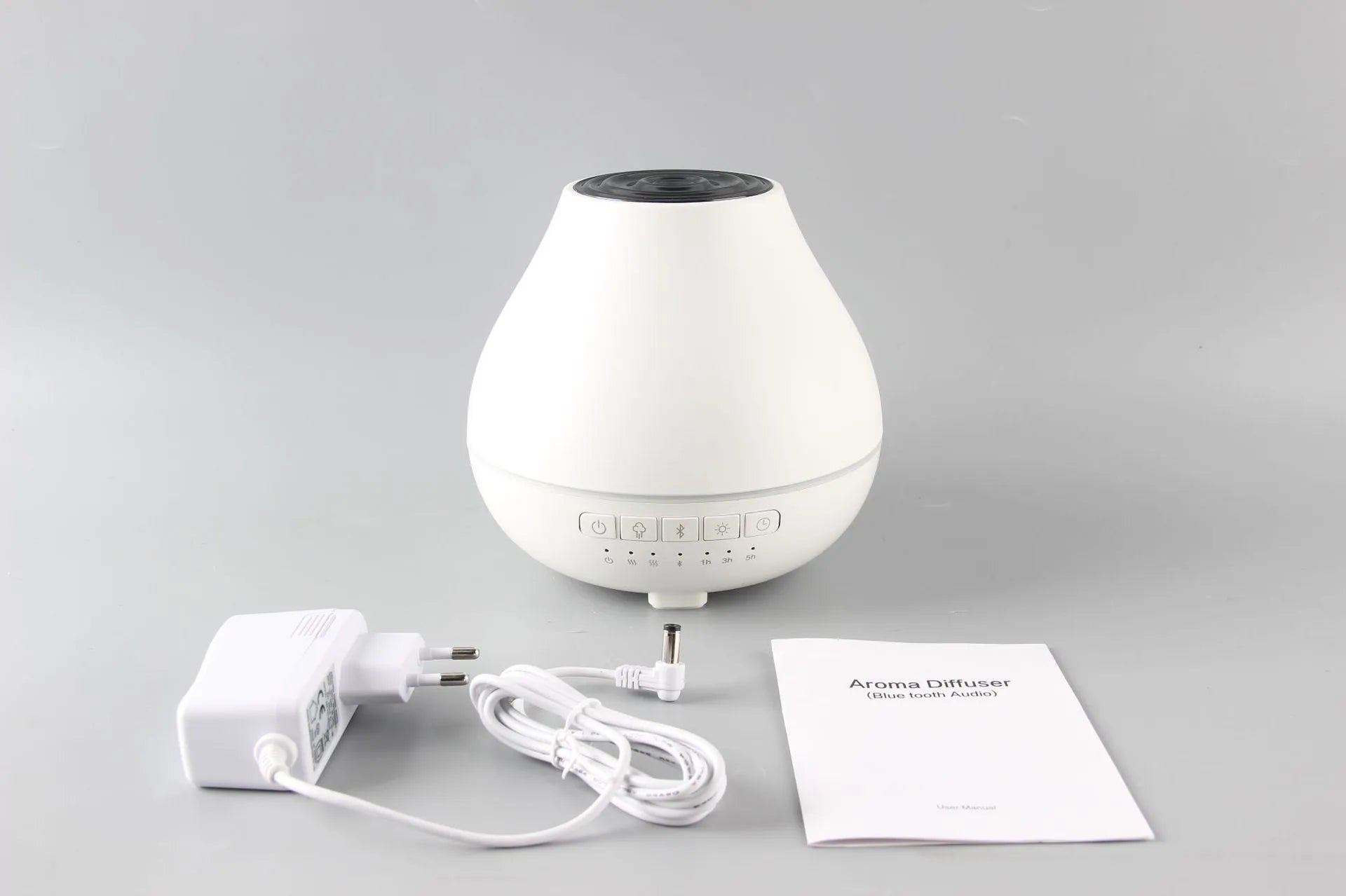 Round white Bluetooth humidifier and aroma diffuser with water tank and control buttons