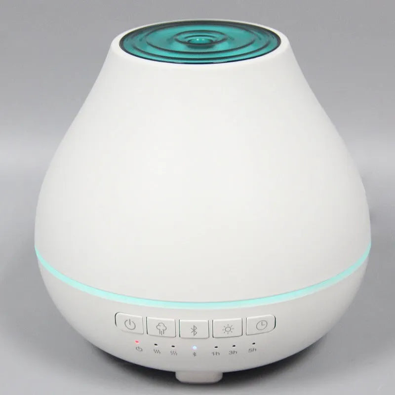 Round white Bluetooth humidifier and aroma diffuser with water tank and control buttons