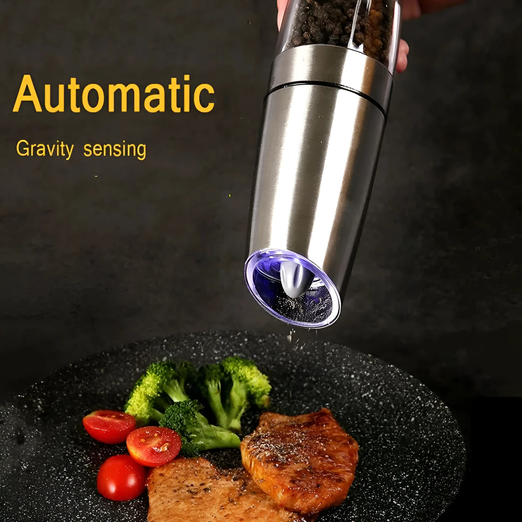 Electric gravity pepper grinder with adjustable coarseness and blue LED light in black ABS finish on wooden table
