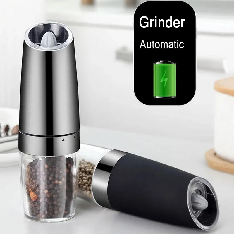 Electric gravity pepper grinder with adjustable coarseness and blue LED light in black ABS finish on wooden table