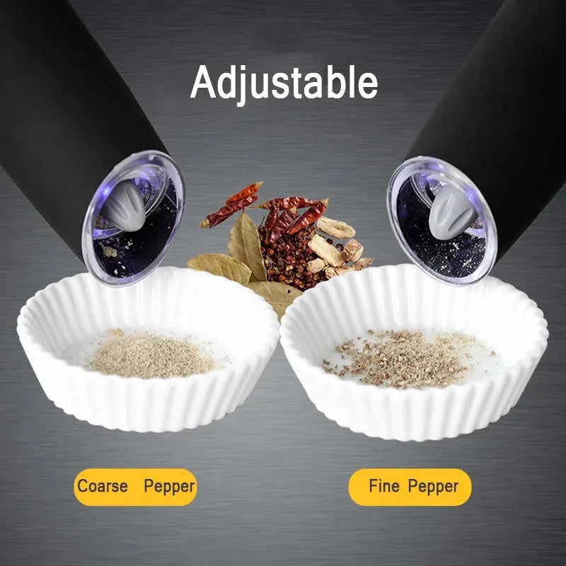Electric gravity pepper grinder with adjustable coarseness and blue LED light in black ABS finish on wooden table