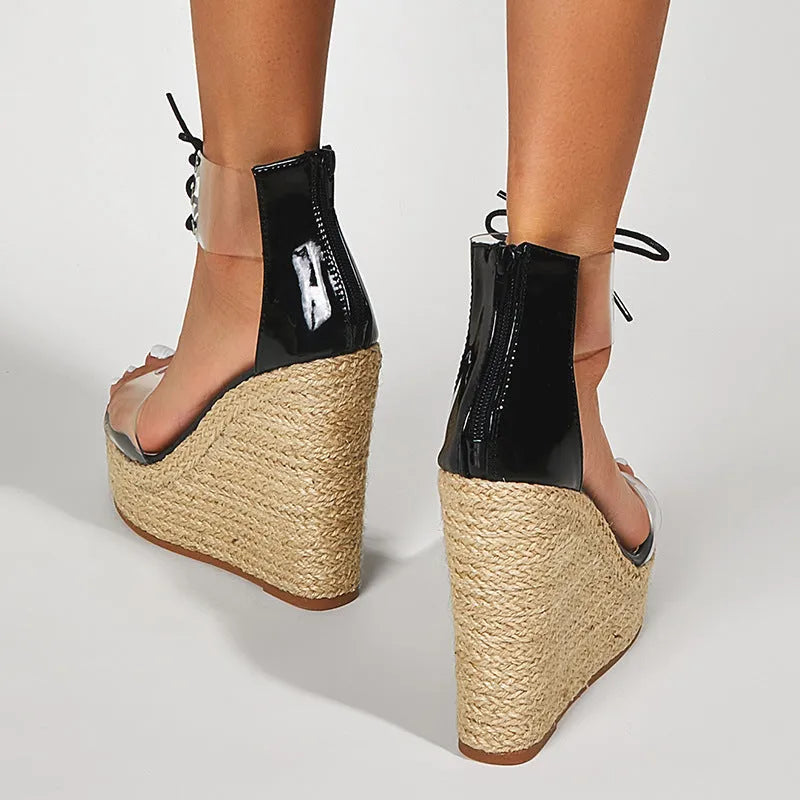Black women's wedge sandals with hemp rope detailing on platform heel and front tie closure