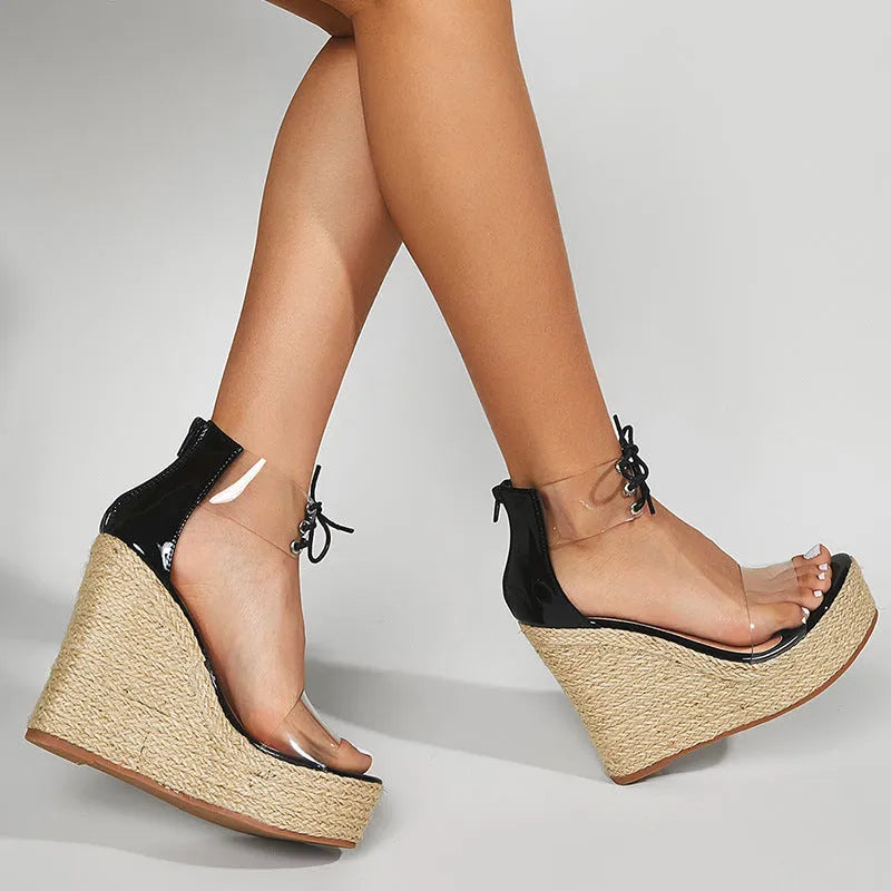 Black women's wedge sandals with hemp rope detailing on platform heel and front tie closure
