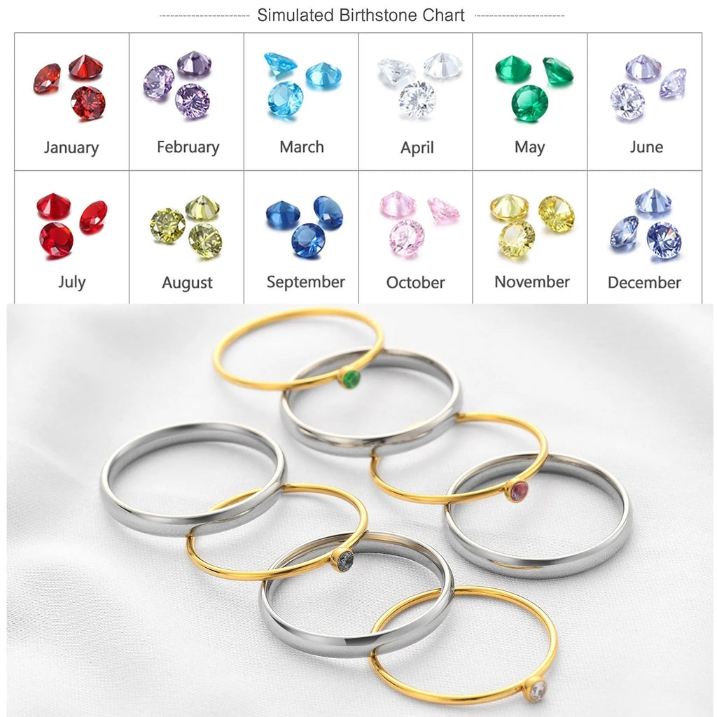 Gold geometric engraved titanium steel ring with a superimposed dark blue December birthstone.