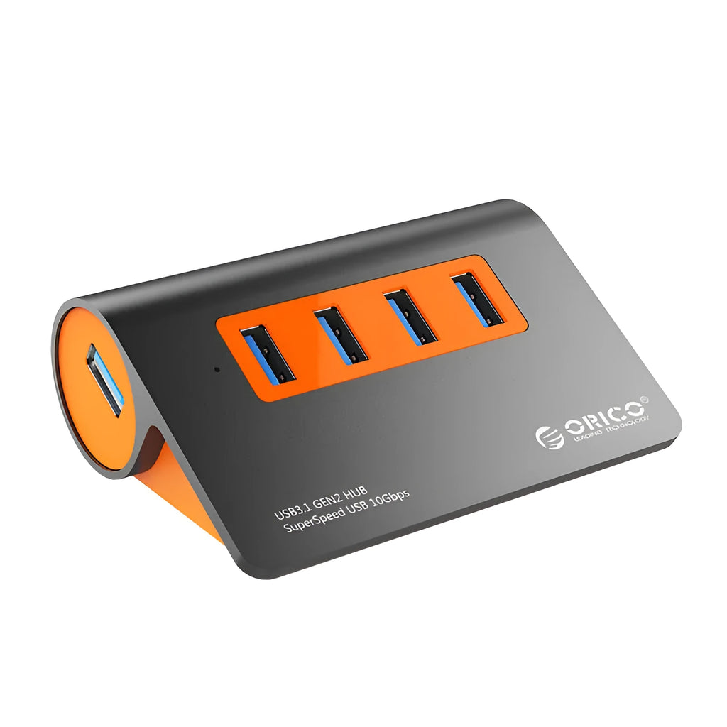 Dark grey aluminium USB hub with four USB 3.1 ports, orange accent, and detachable 100cm cable