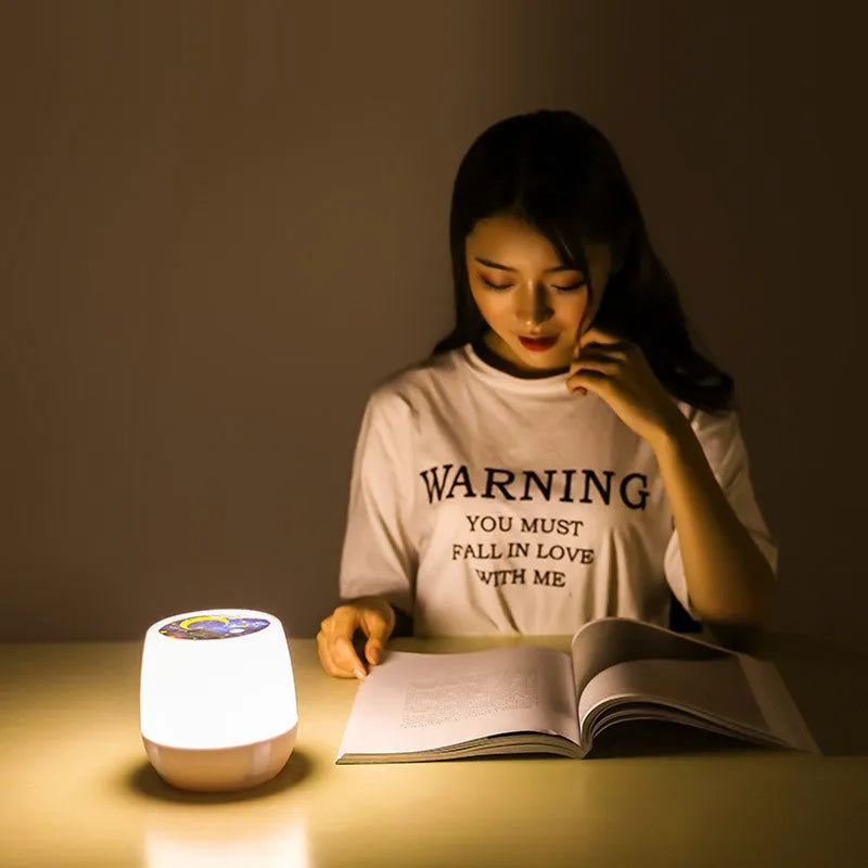 Pruixin rotating projector night light showing star pattern projection on a bedroom ceiling.