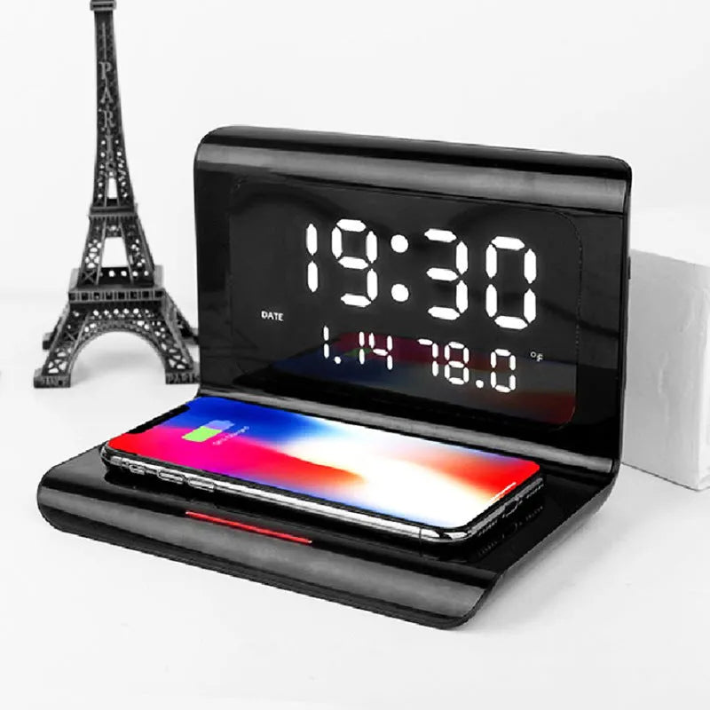 Wireless charger alarm clock showing time, calendar, temperature and humidity display with smartphone charging