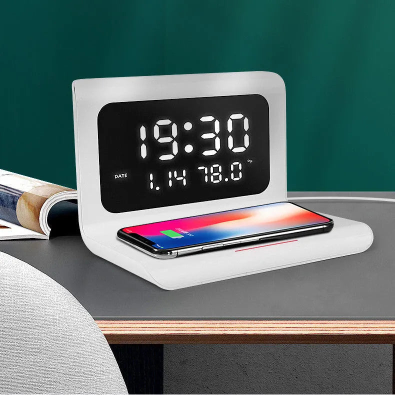 Wireless charger alarm clock showing time, calendar, temperature and humidity display with smartphone charging