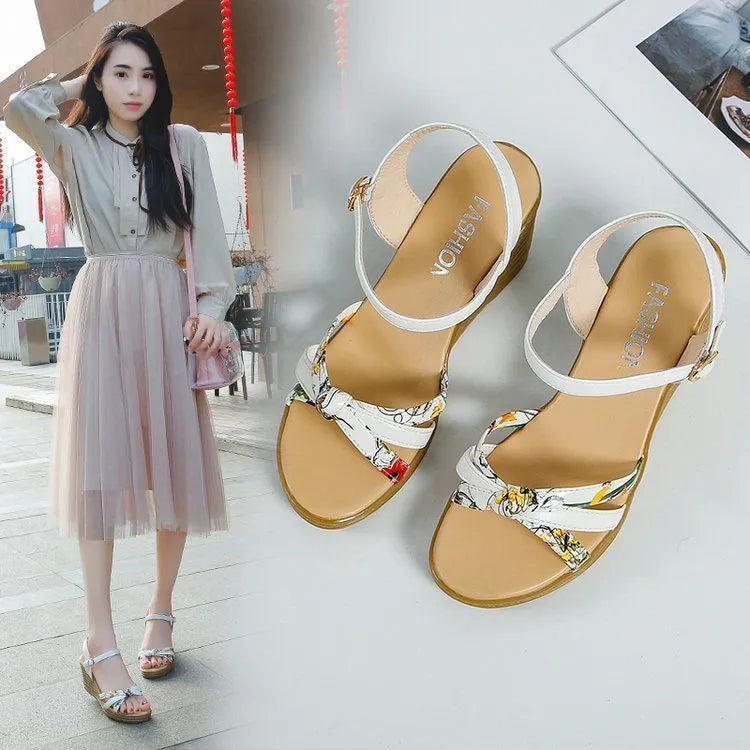Women's pink wedge sandals with thick heel and buckle closure on white background