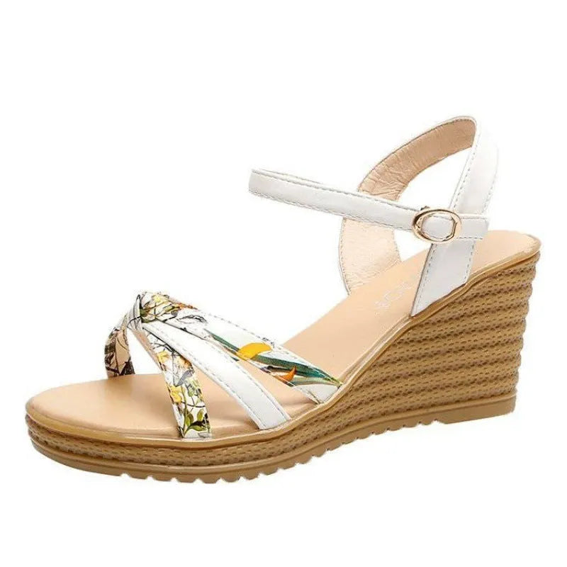 Women's pink wedge sandals with thick heel and buckle closure on white background