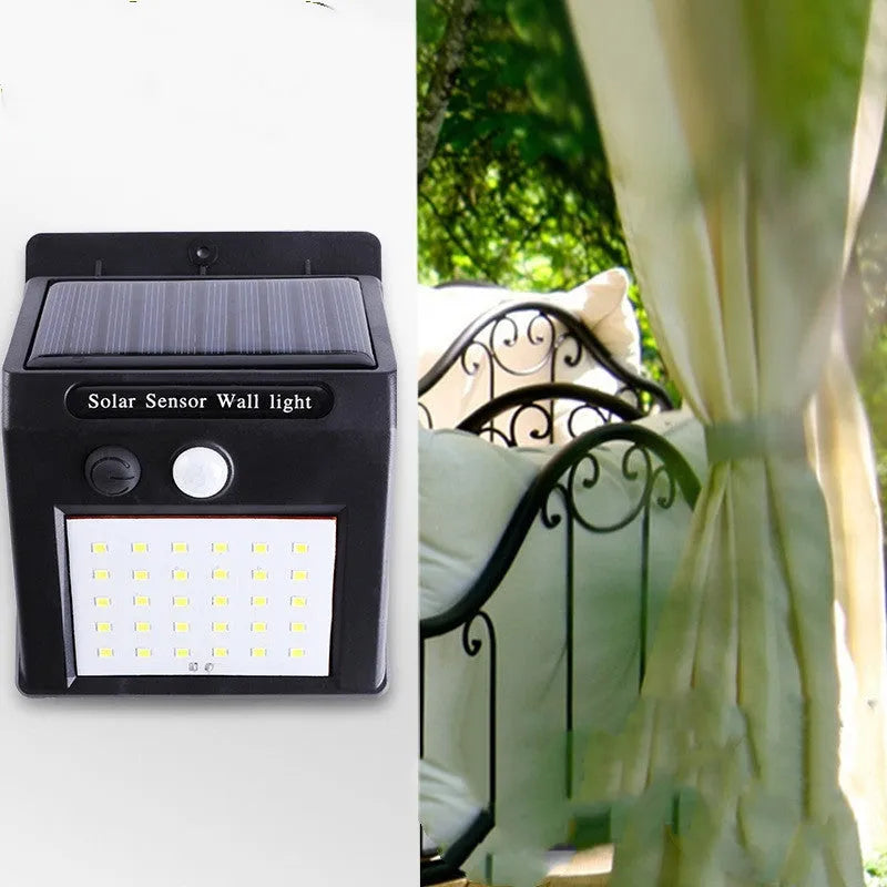 Solar outdoor garden lamp with motion sensor and LED bulbs for automatic night lighting