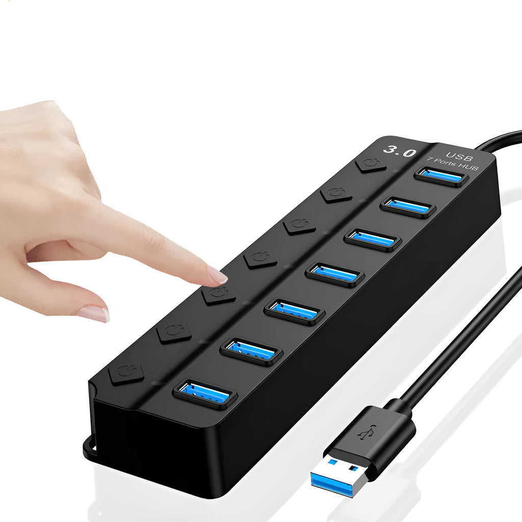 Black 7-port USB 3.0 hub with external power supply on a desktop.
