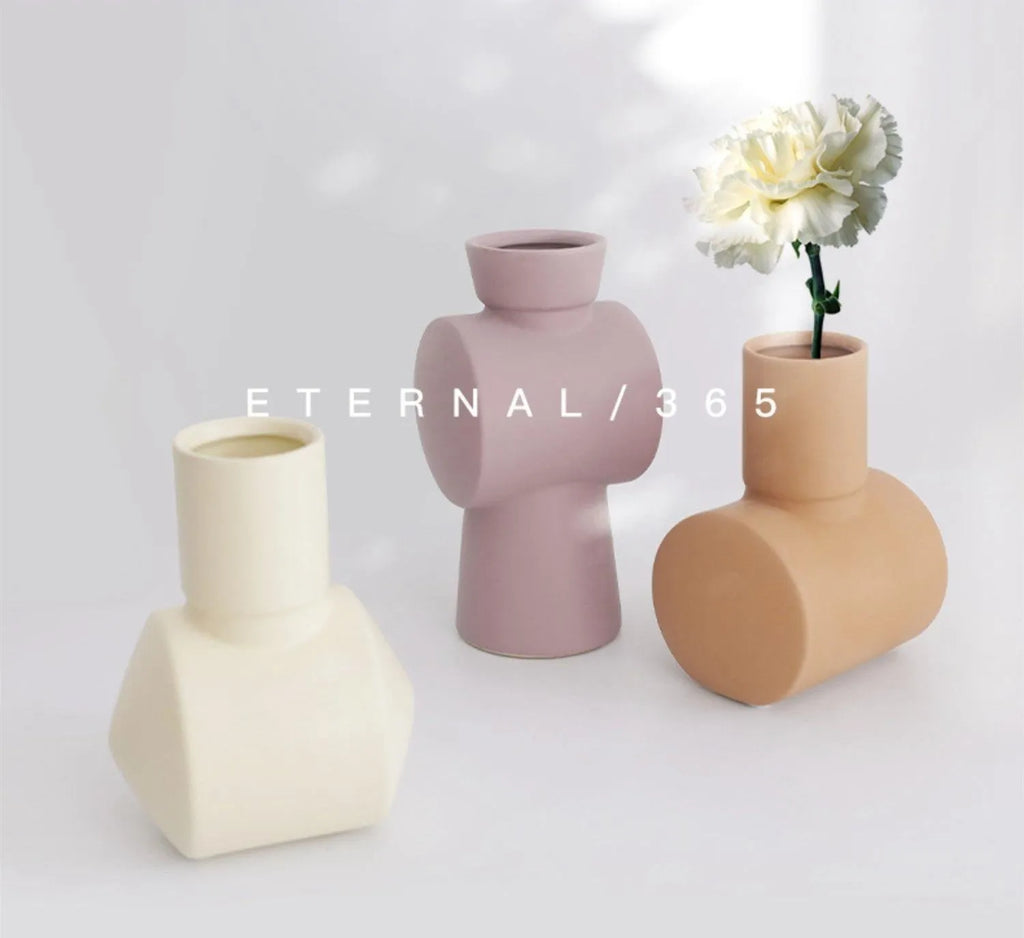 Nordic style ceramic vase with hammered texture in beige, brown, or purple colour glaze.