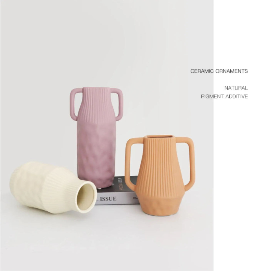 Nordic style ceramic vase with hammered texture in beige, brown, or purple colour glaze.