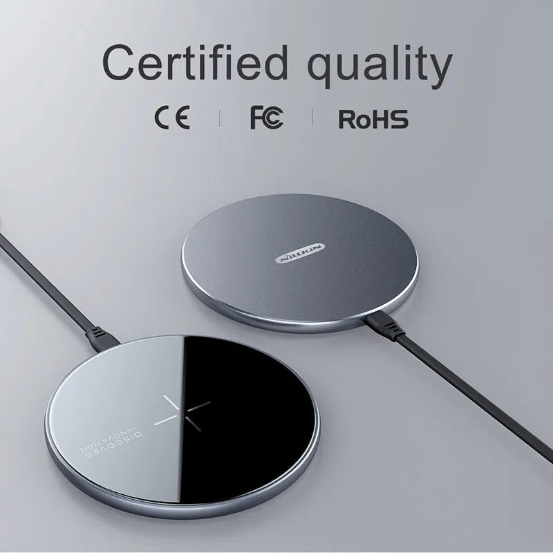 MagSlim magnetic wireless charger NKT06 in Black on a desk with a phone placed on it