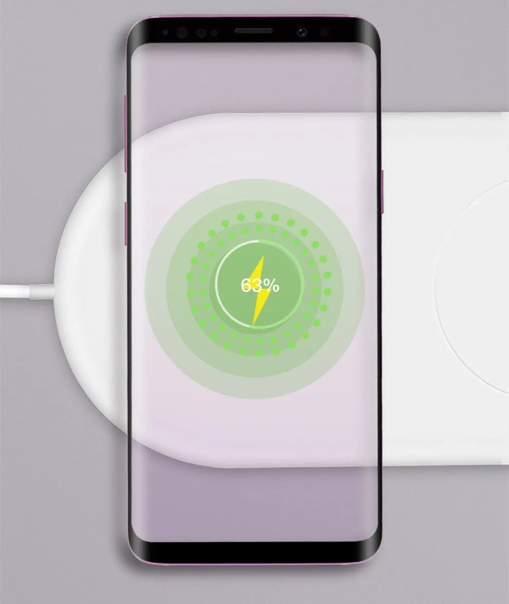 White dual wireless charger for mobile phones showing two devices charging simultaneously